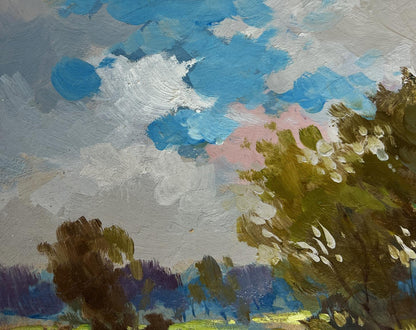 Oil painting The Road to the Golden Fields by Yuriy Suprunchuk with blue cloudy sky over trees