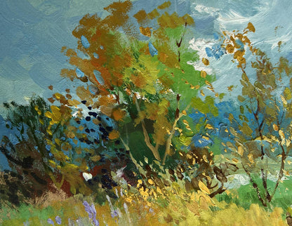 Vibrant impressionist oil painting by Yuriy Suprunchuk of autumn trees in flower fields