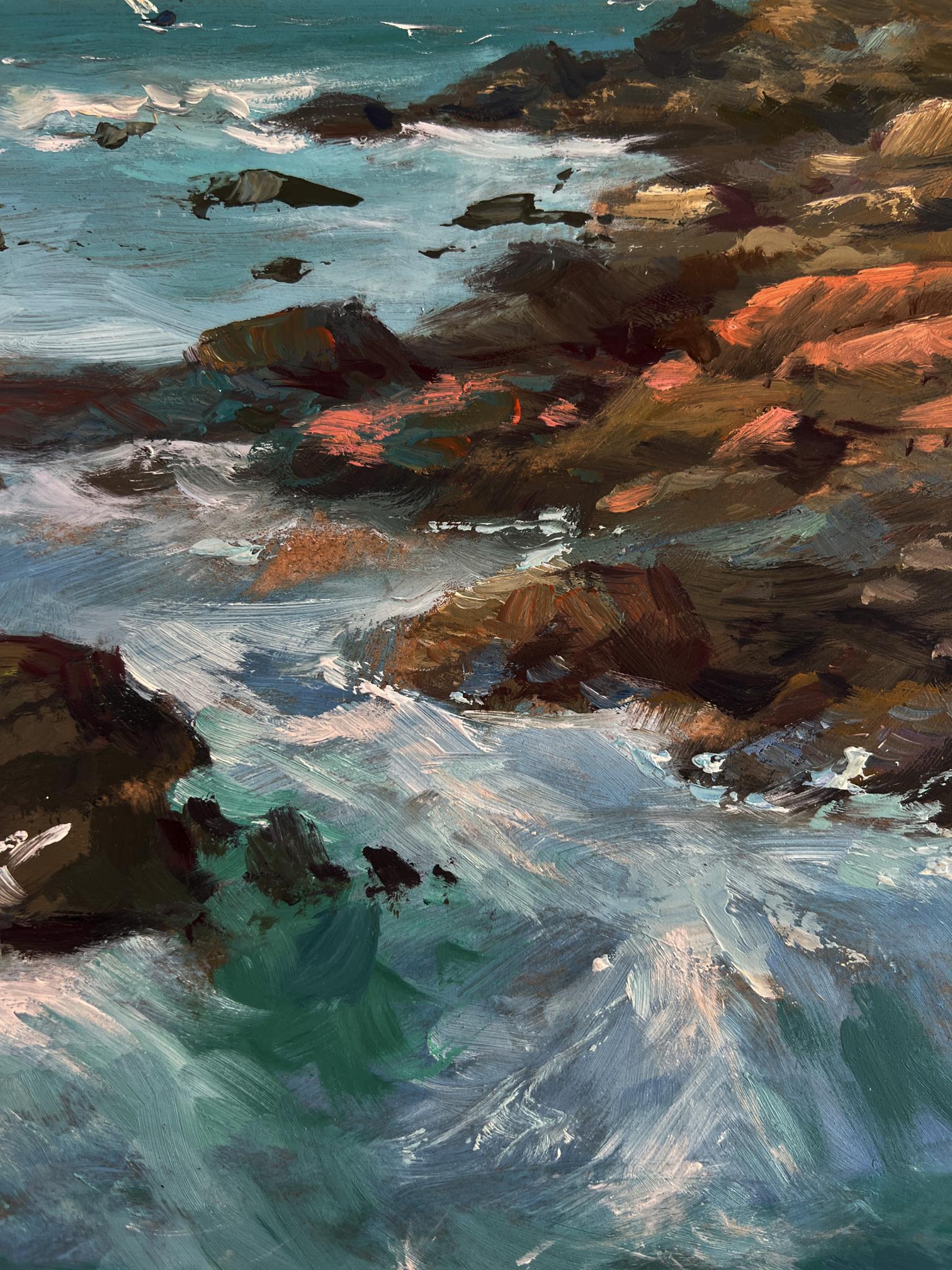 Textured ocean waves crashing on sunlit rocks with distant sailboats by Yuriy Suprunchuk