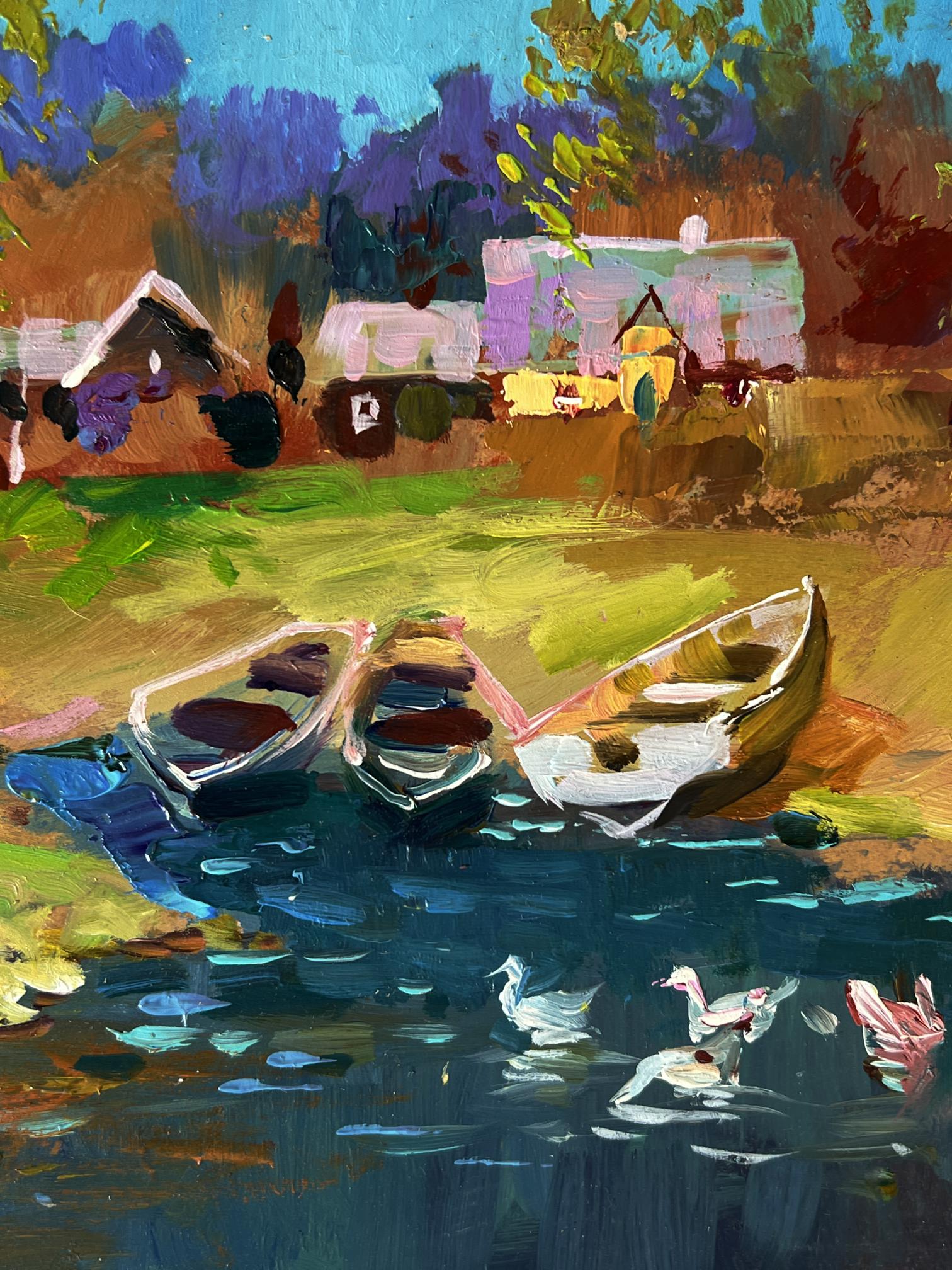 Oil painting of geese swimming by river with rowboats near village shore by Yuriy Suprunchuk