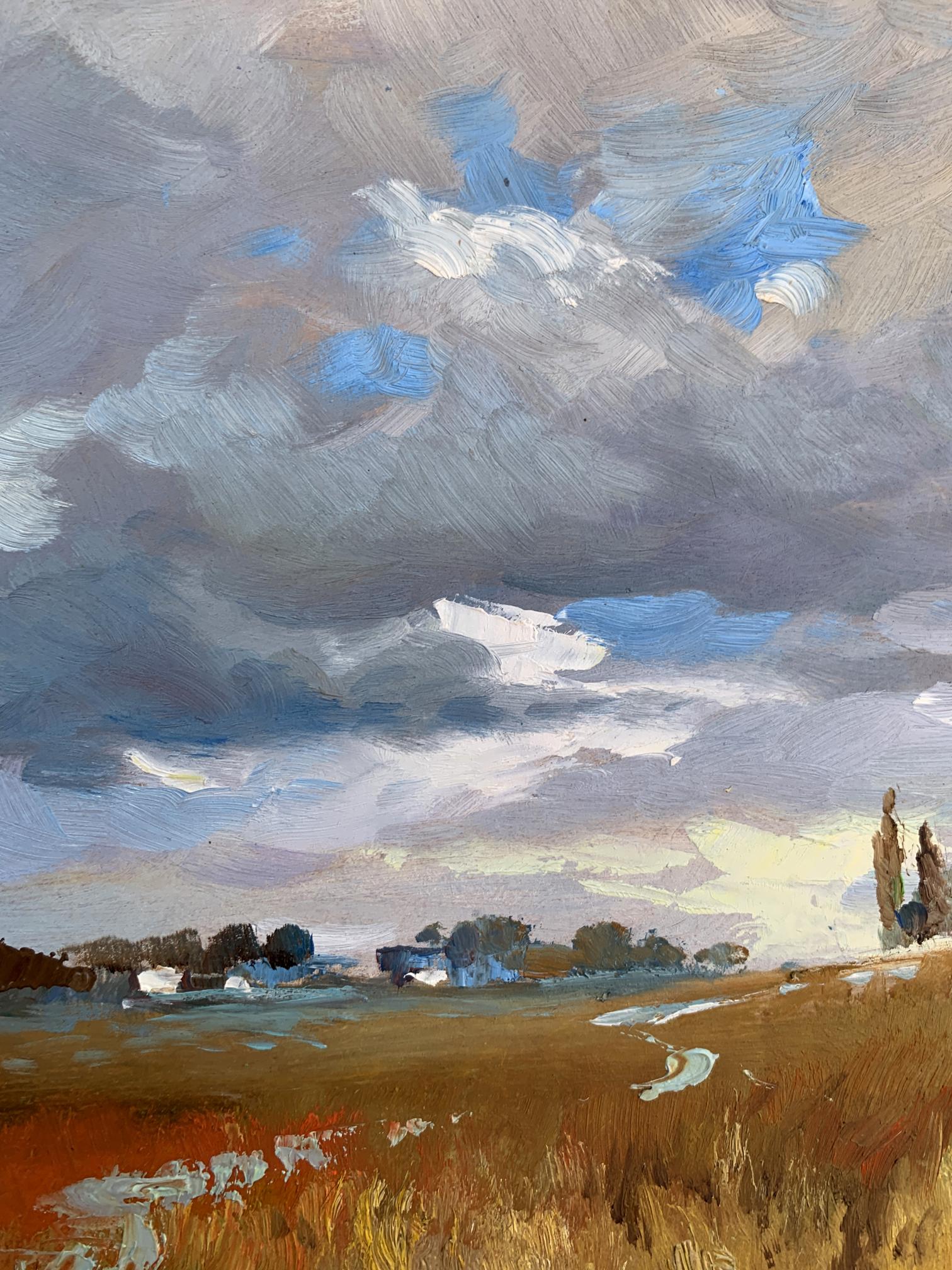 Oil painting Not far from the village by Yuriy Suprunchuk: dramatic sky over golden field