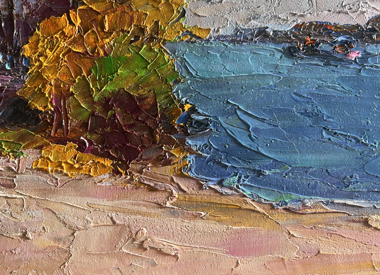 Oil painting Evening after a thunderstorm by Boris Serdyuk: vibrant autumn tree by blue water