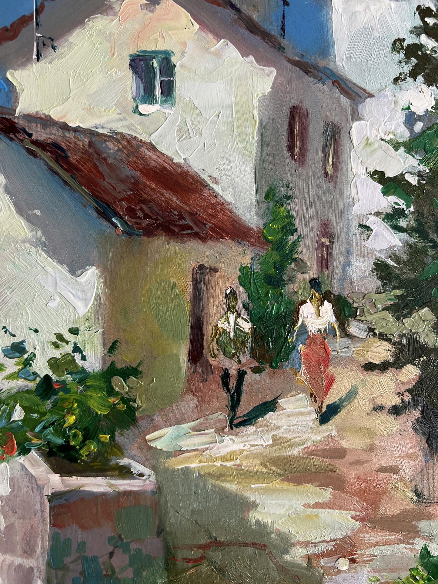 Oil painting by Yuriy Suprunchuk: sunlit village street with white buildings