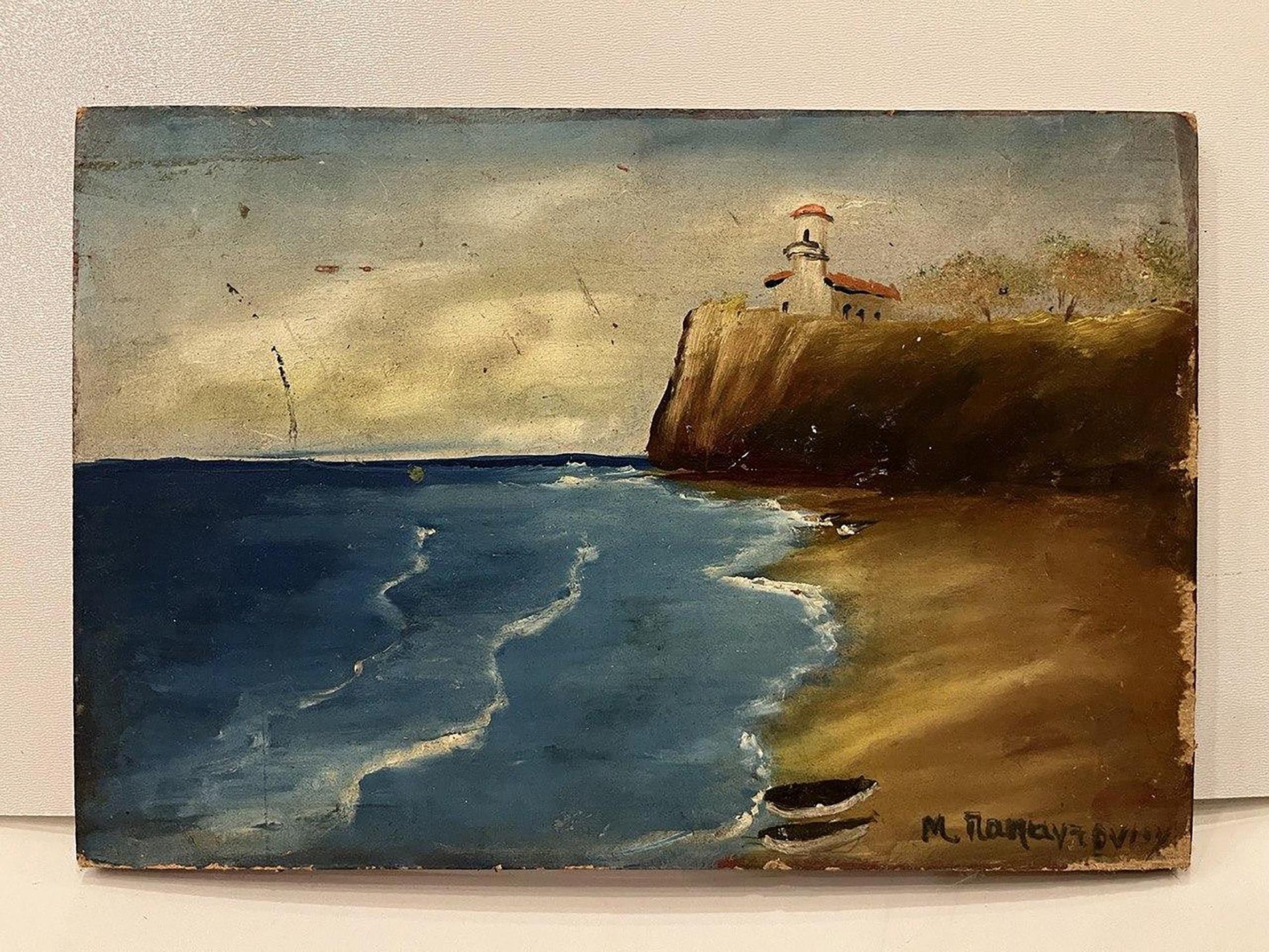 Weathered oil painting of lighthouse house on cliff overlooking ocean
