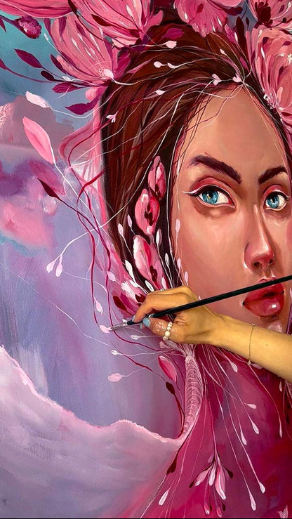 Hand holding fine paintbrush over vibrant pink Pions Victoria Kagalovska oil painting