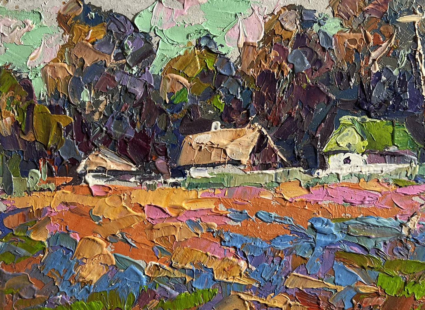 Oil painting of colourful fields and village by Oksana Ivanyuk
