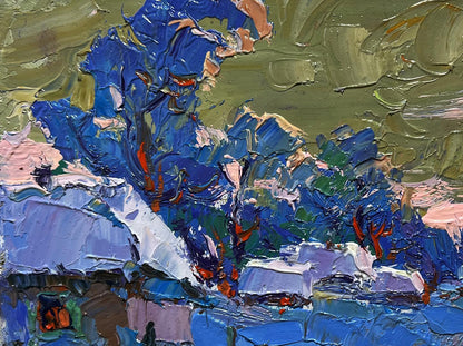 Oil painting of snowy village by Oksana Ivanyuk with blue green brushstrokes