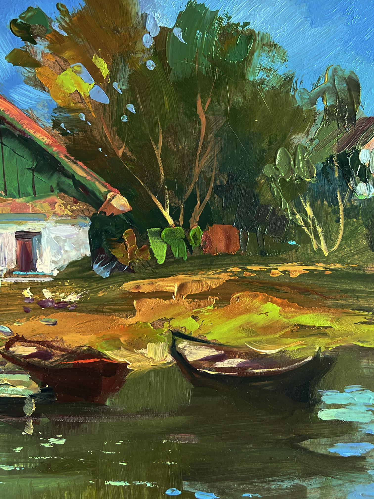 Vibrant impressionist oil painting by Yuriy Suprunchuk of rowboats near house