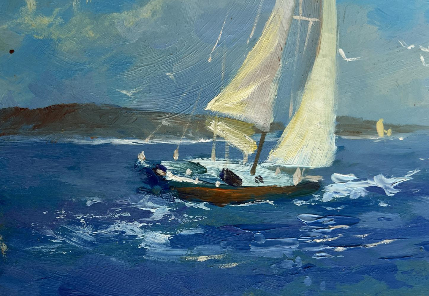 Oil painting of sailboat with cream sails on blue ocean by Yuriy Suprunchuk