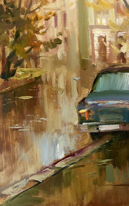Oil painting Autumn in the Old Quarter by Yuriy Suprunchuk: vintage teal car on wet street