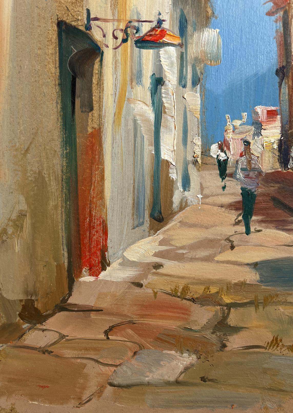 Vibrant oil painting by Yuriy Suprunchuk: sunlit city alley with figures