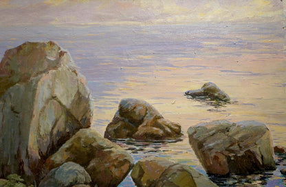 Oil painting of rough textured rocks in beige brown tones by coast waters edge