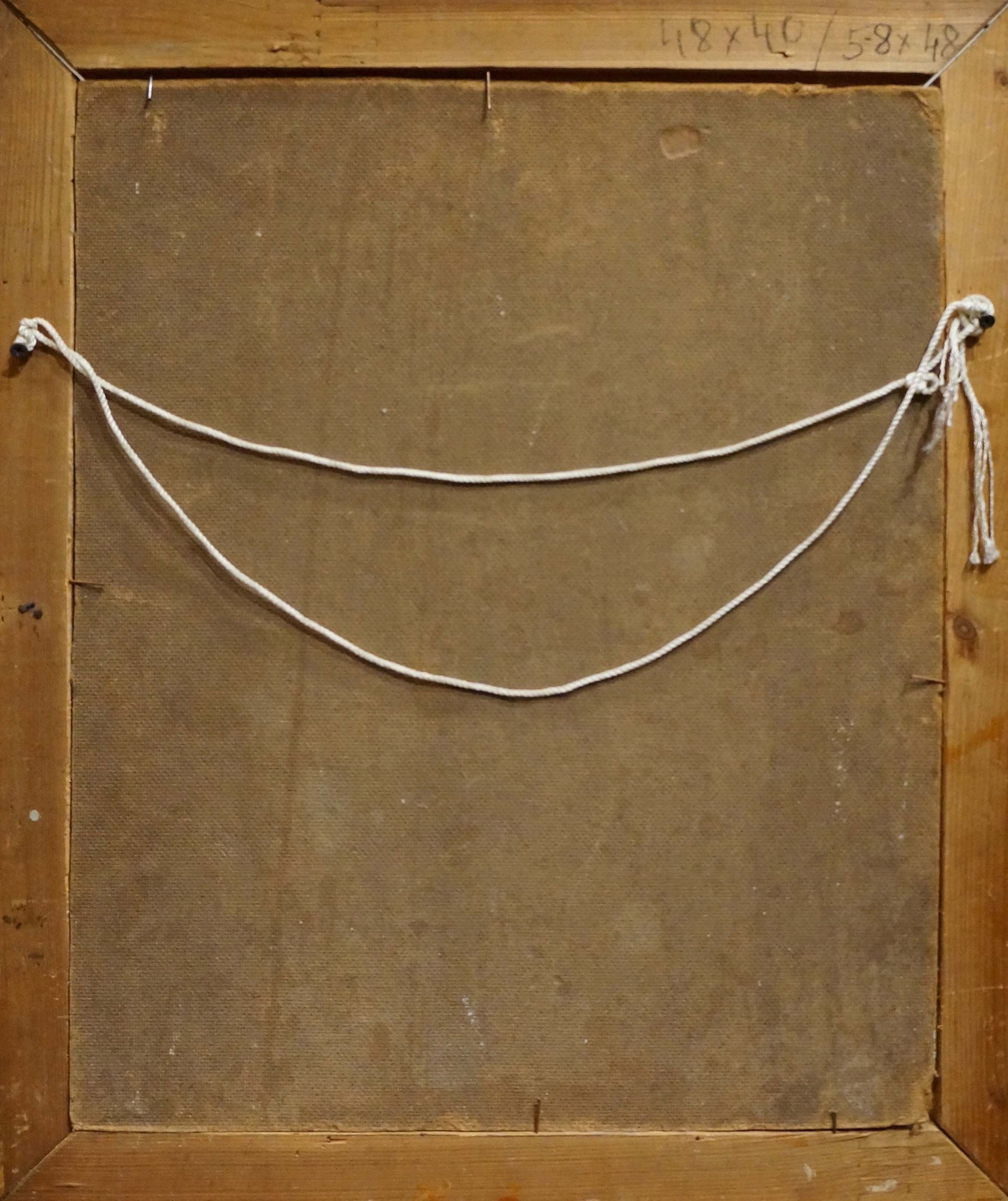 Back of oil painting portrait by R.-Ukrainian artist with white knotted string on wooden frame