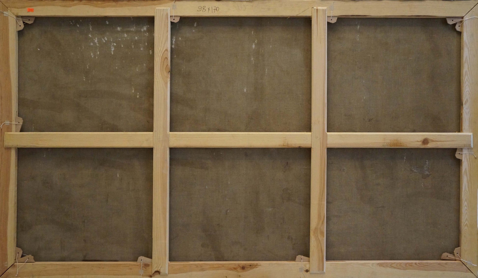 Back of light wood canvas frame with grid supports for Alexander Ferber oil painting Tourist town