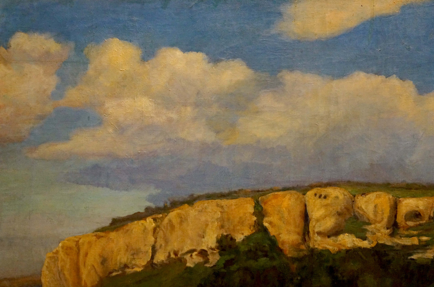 Oil painting by Nagaevskaya Elena Varnavovna: golden-yellow cliffside under blue sky