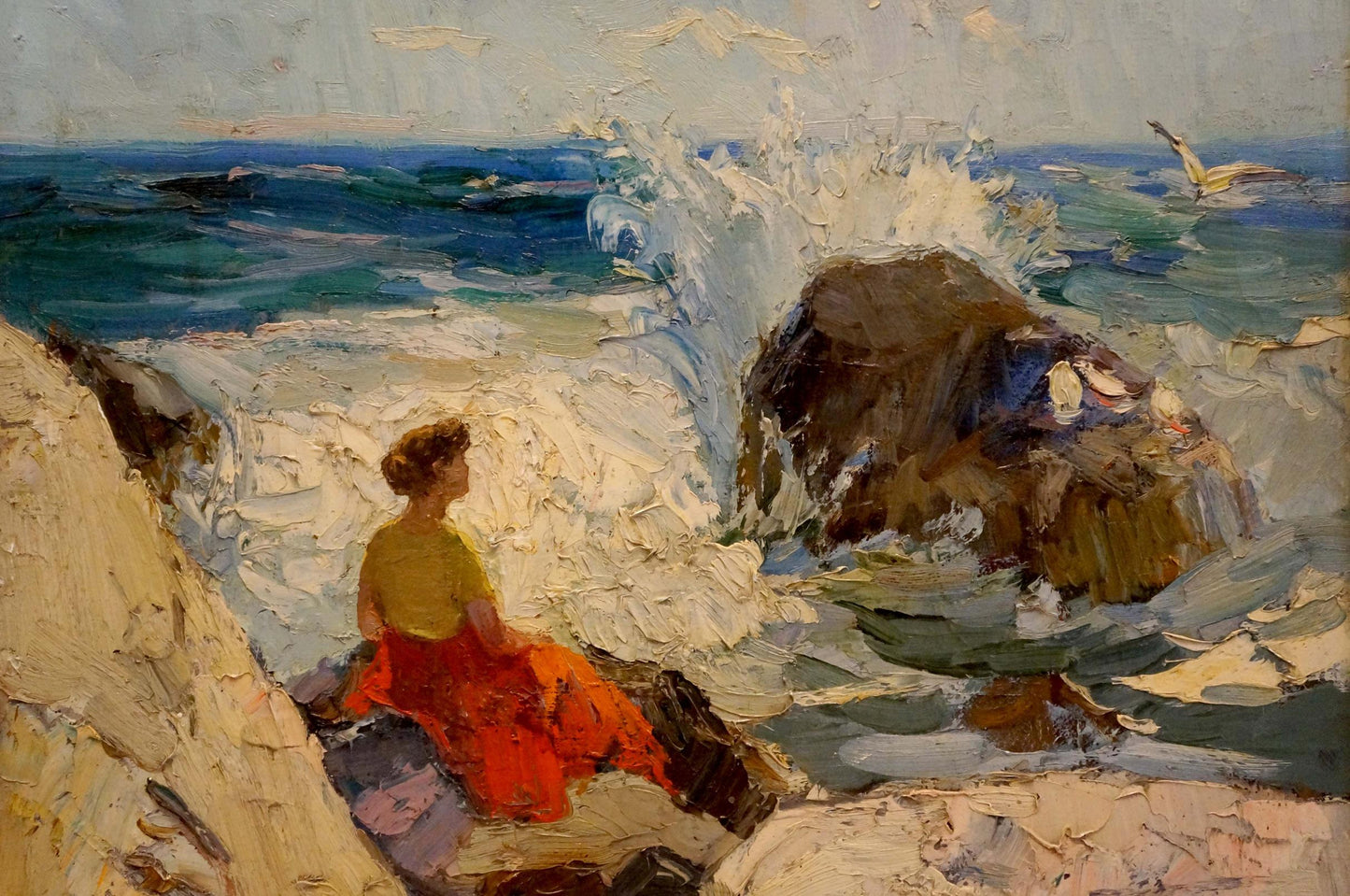 Oil painting by Y. Yarovoy Stepan Kalinovich: woman in yellow top and red skirt on rocky ocean shore