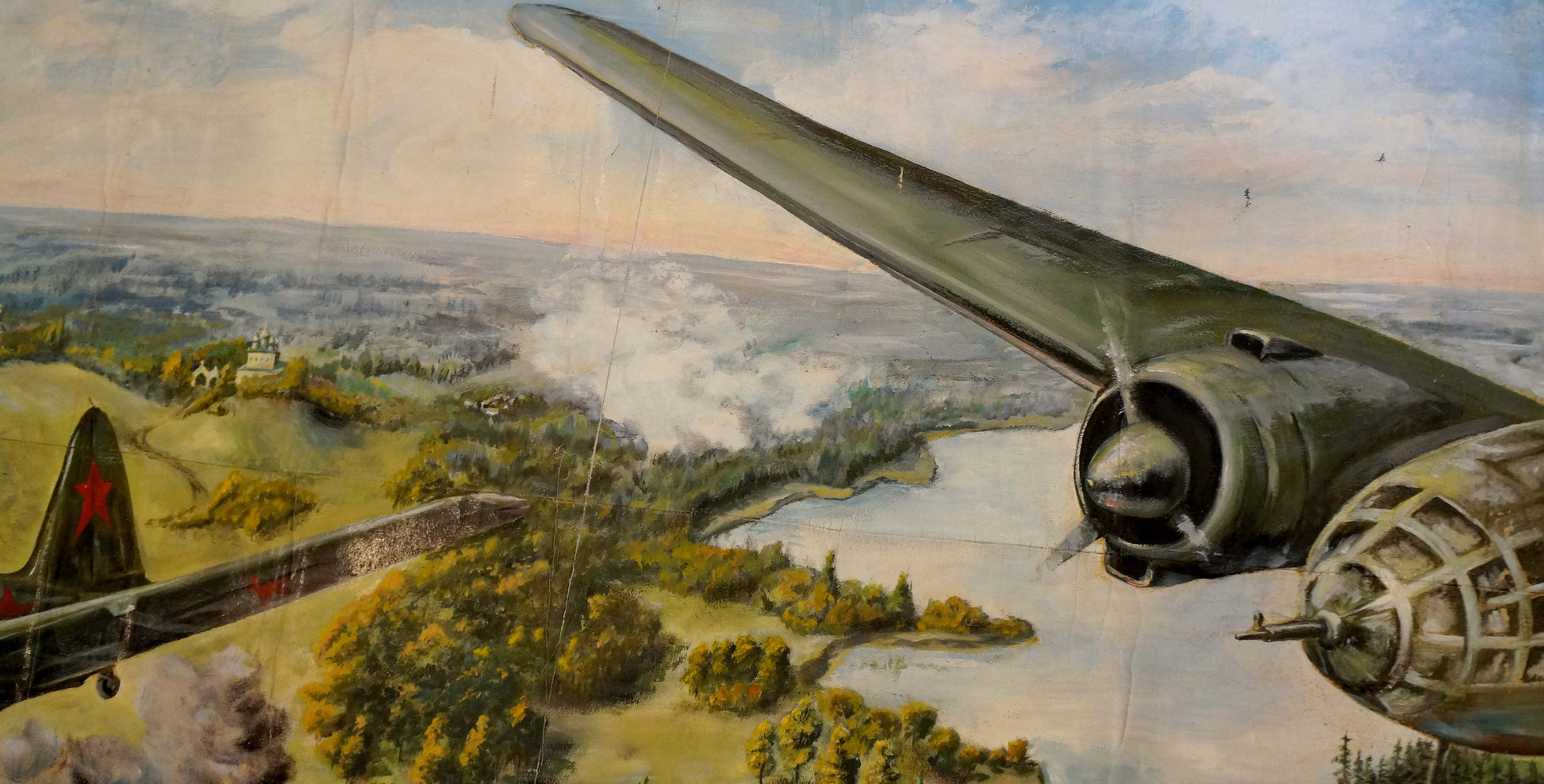 Oil painting of olive green airplane wing with red star over battlefield