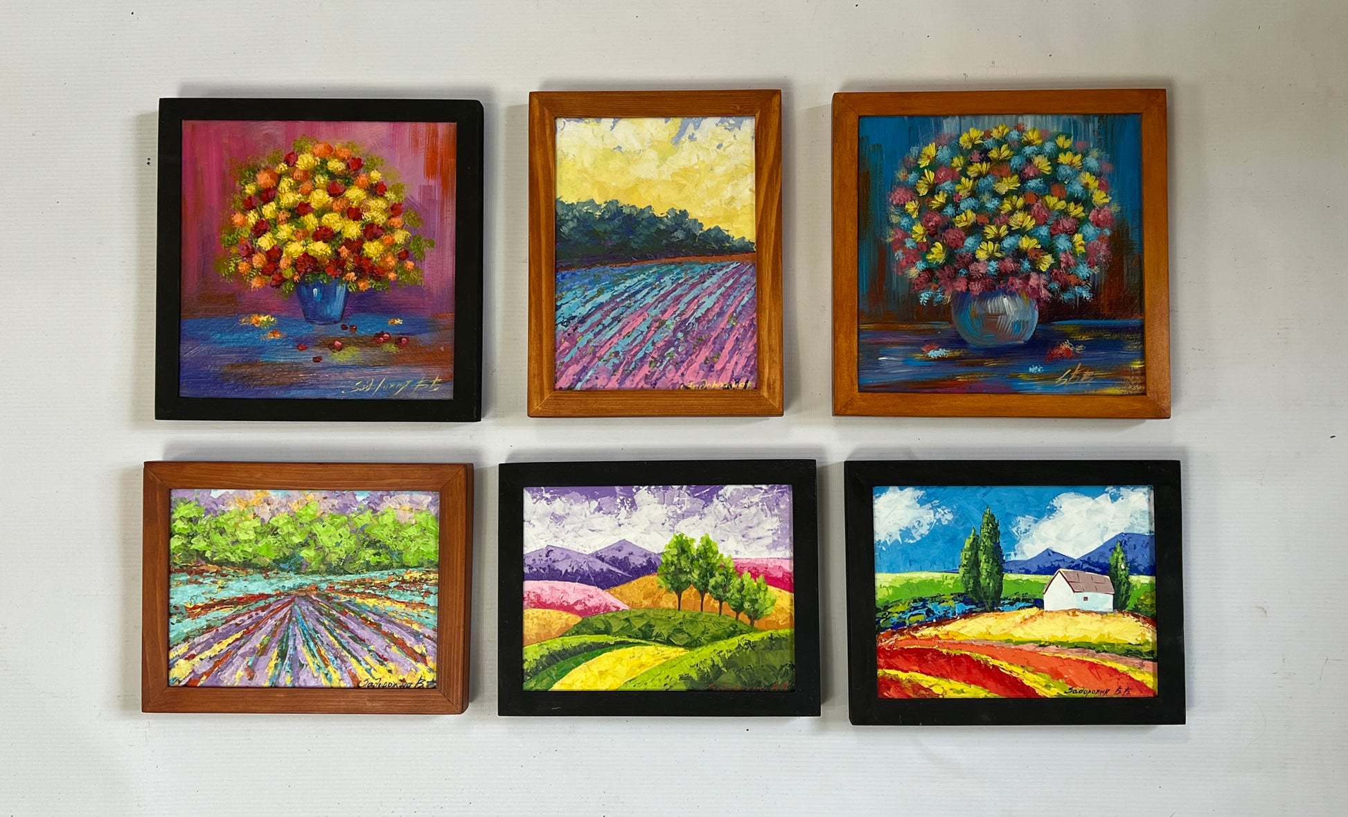 Set of six vibrant square-framed floral and pastoral paintings for wholesale