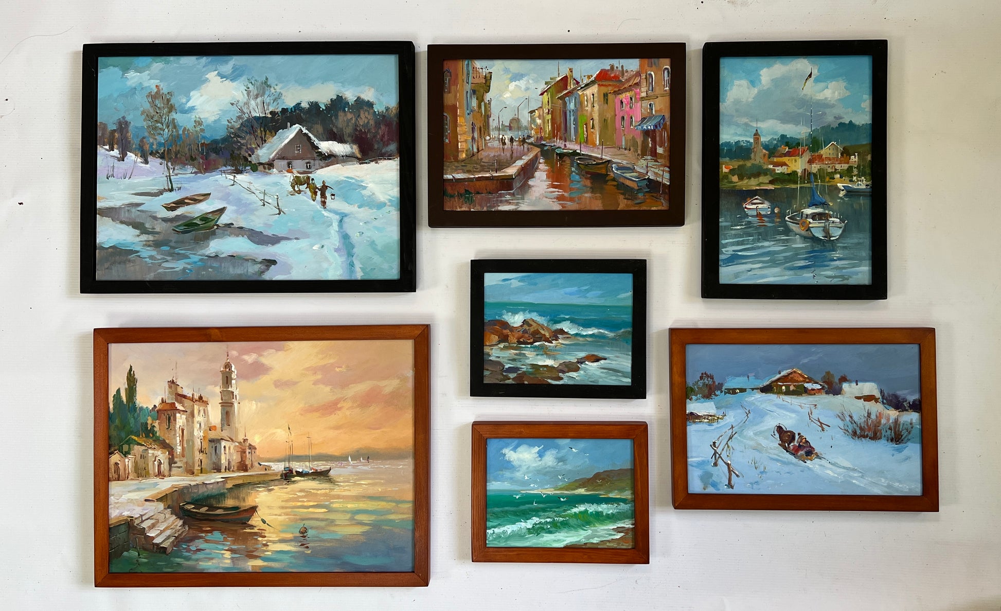 Set of 7 framed oil paintings of coastal snowy landscapes for wholesale