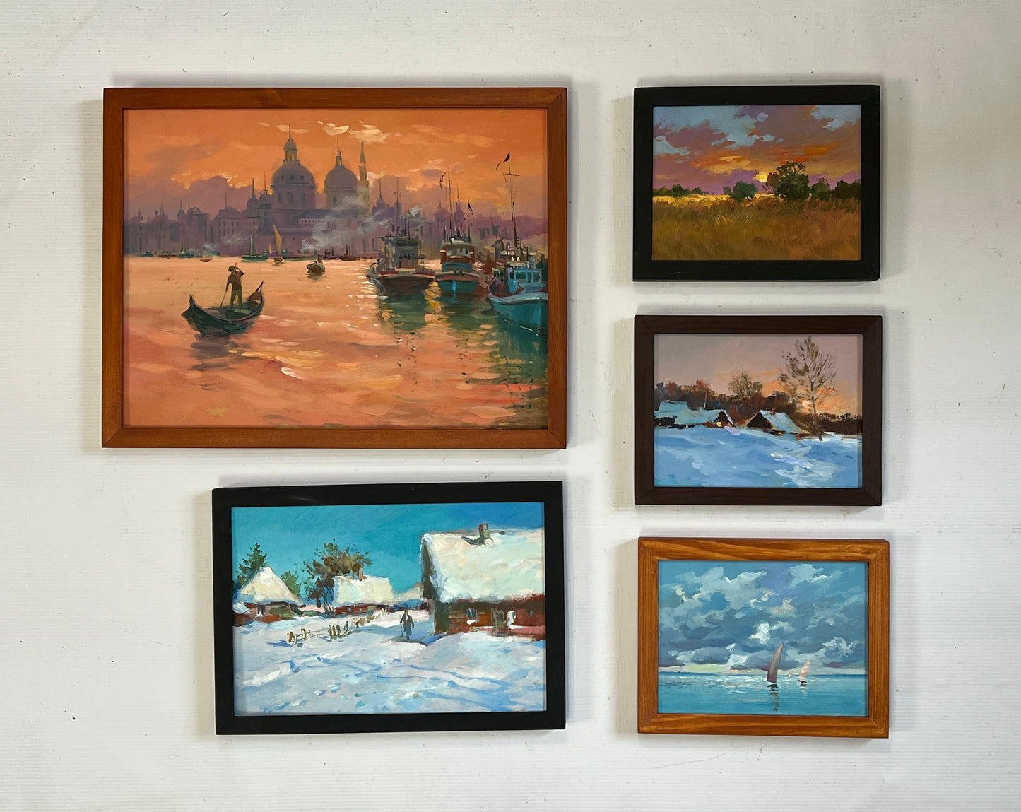 Wood-framed oil painting of sunset harbor with boats and reflections, wholesale