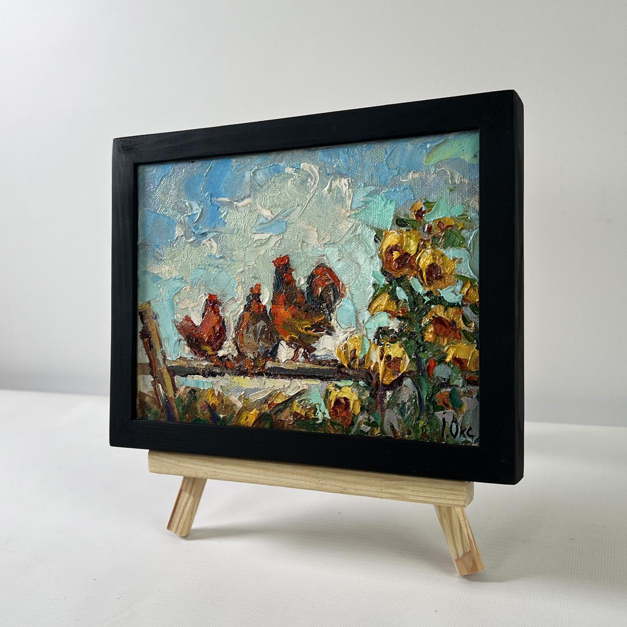 Oil painting Morning rooster crowing by Oksana Ivanyuk in black frame on easel