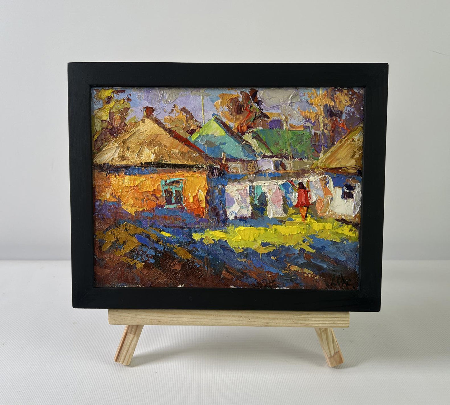 Vibrant impressionist oil painting of sunny country village day by Oksana Ivanyuk in black frame