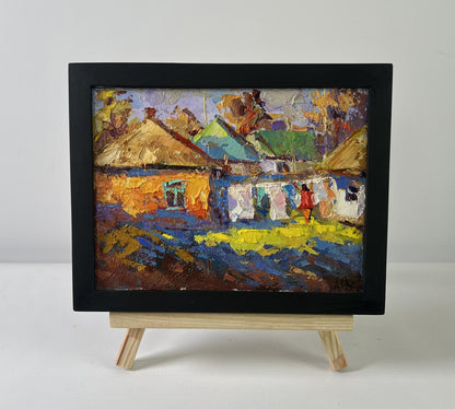 Vibrant impressionist oil painting of sunny country village day by Oksana Ivanyuk in black frame