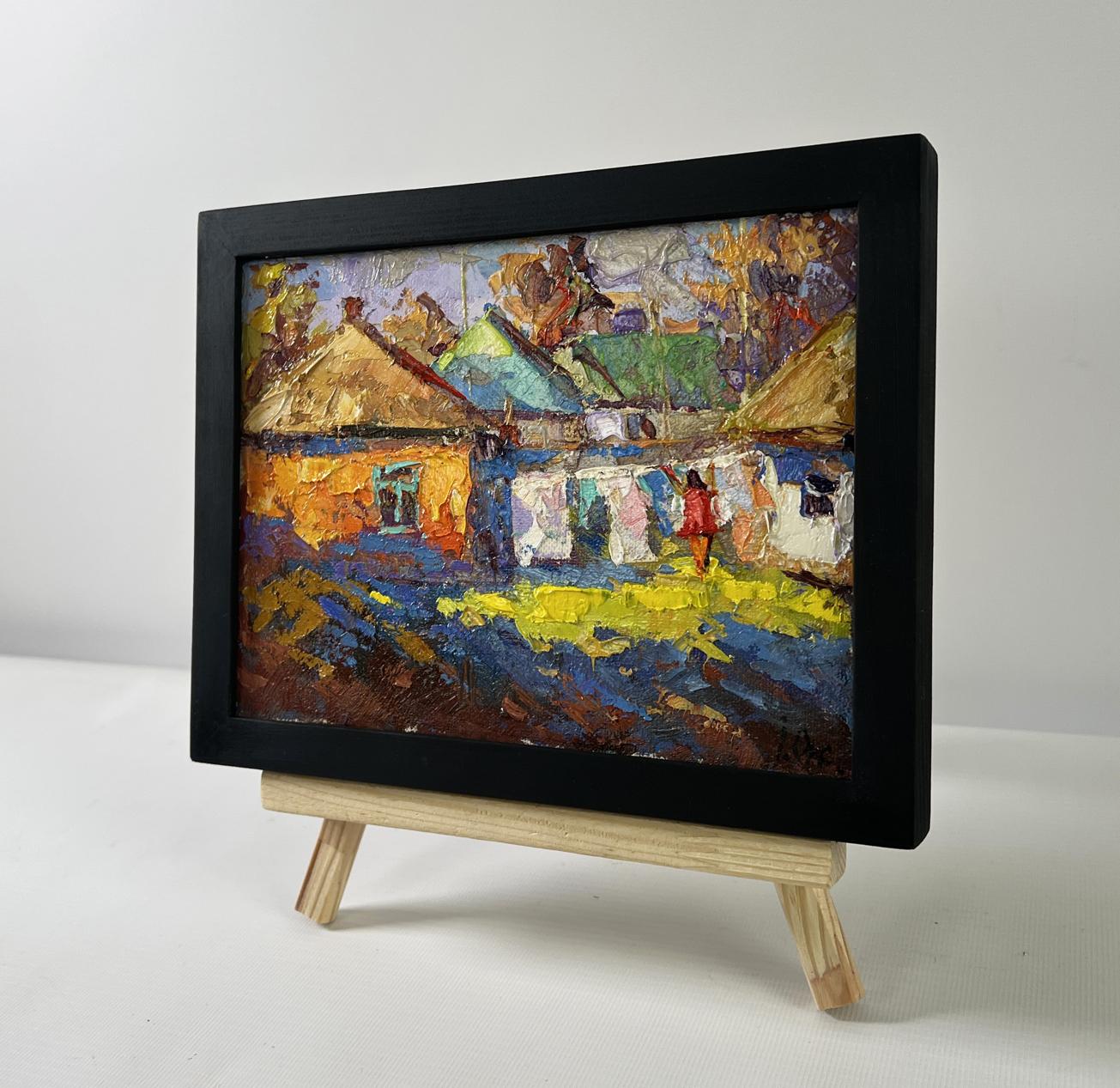 Oil painting A sunny country day by Oksana Ivanyuk in black frame on easel