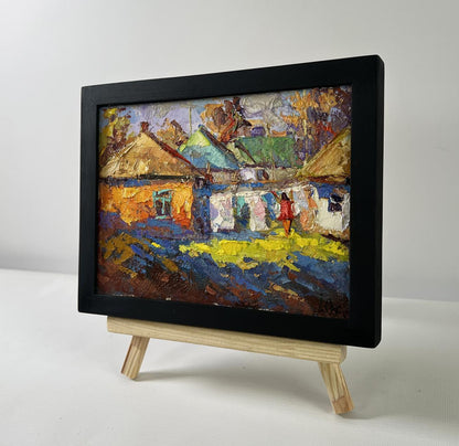 Oil painting A sunny country day by Oksana Ivanyuk in black frame on easel