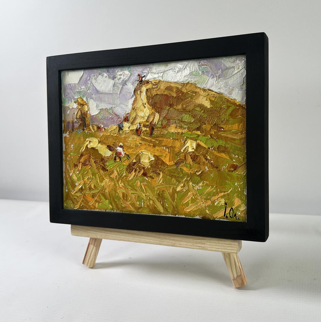 Oil painting Work in the Field by Oleksiy Ivanyuk on wooden easel