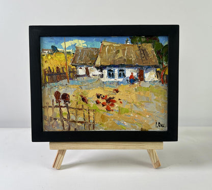 Oil painting of busy courtyard by Oksana Ivanyuk on wooden easel