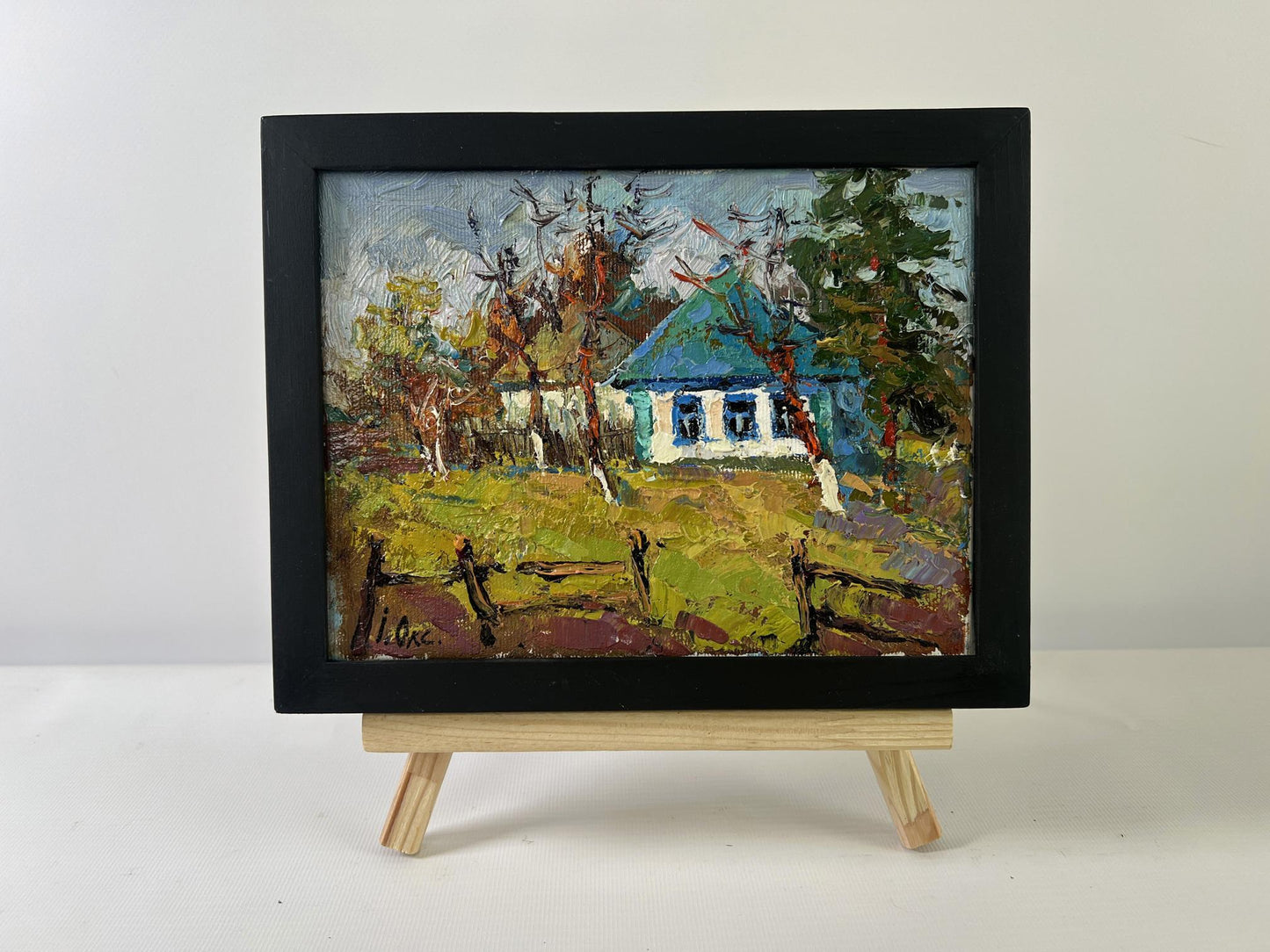 Oil painting Cold March days by Oksana Ivanyuk rustic house in black frame