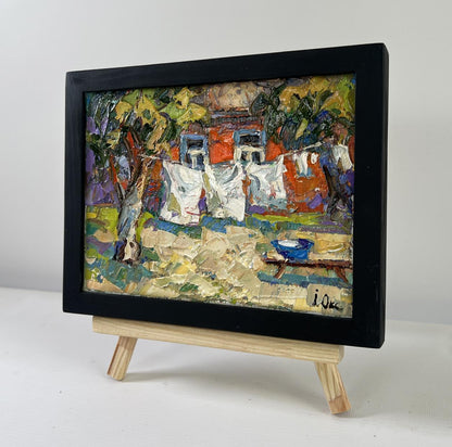 Oil painting Clothes are drying by Oksana Ivanyuk in black frame