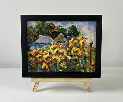 Vibrant Oksana Ivanyuk sunflower gardens oil painting in black frame on easel