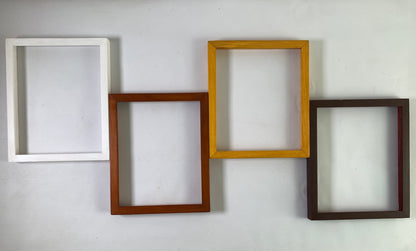 Four custom wooden frames in white, brown, oak, espresso on wall