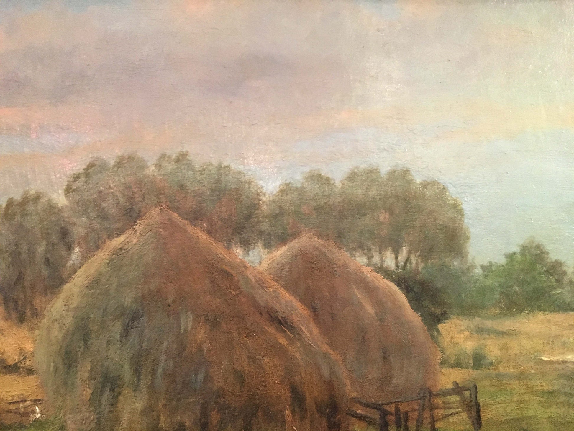 Oil painting of two rustic hay bales in field by Sergei Ivanovich Svetoslavsky