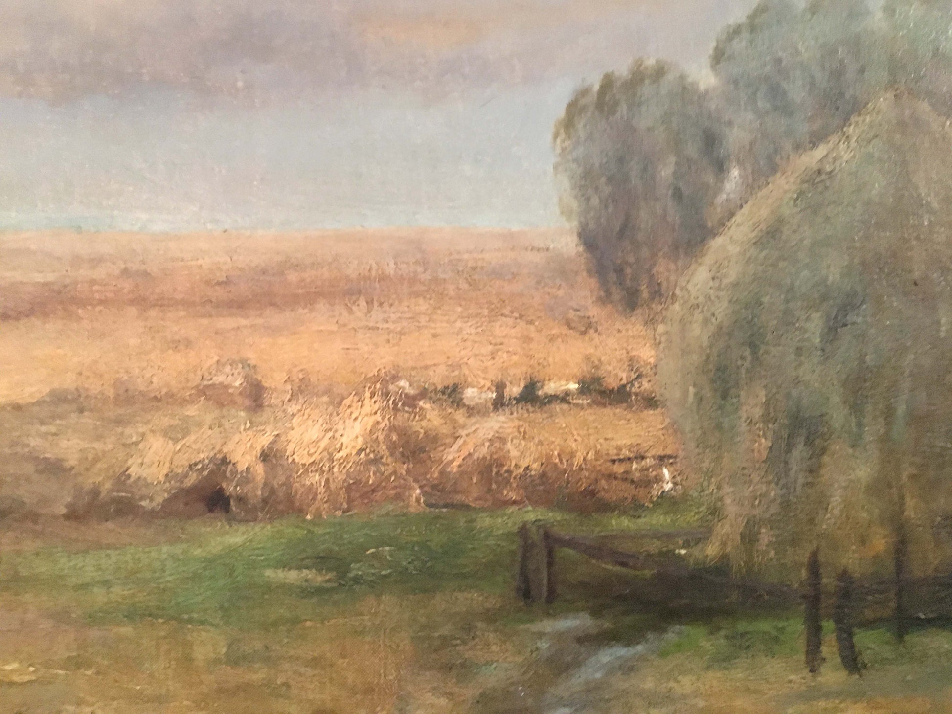 Oil painting Haystacks by Sergei Ivanovich Svetoslavsky: golden field, hay bales, trees