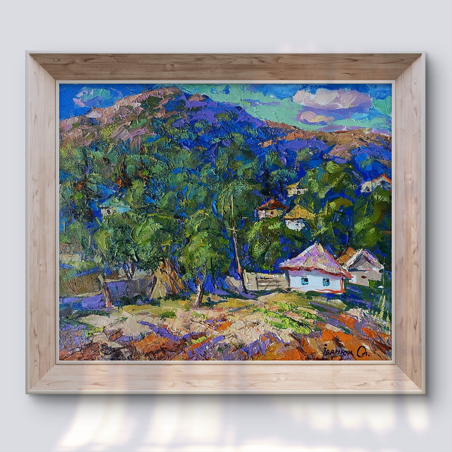 Oil painting A village in a valley by Oleksiy Ivanyuk in light wood frame