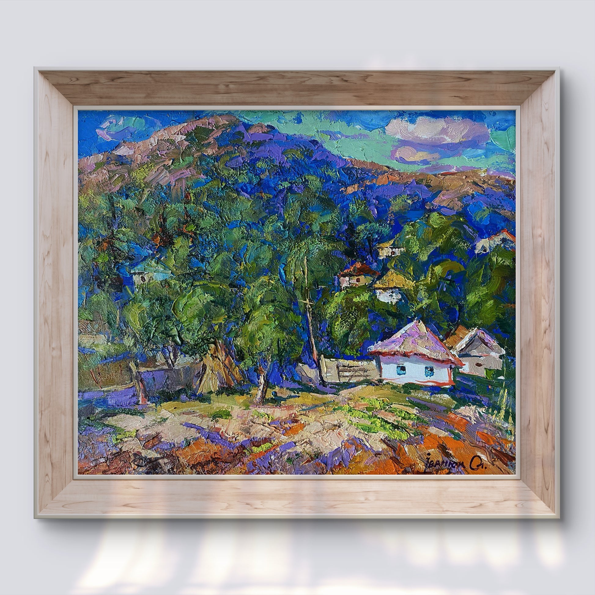 Oil painting A village in a valley by Oleksiy Ivanyuk in light wood frame