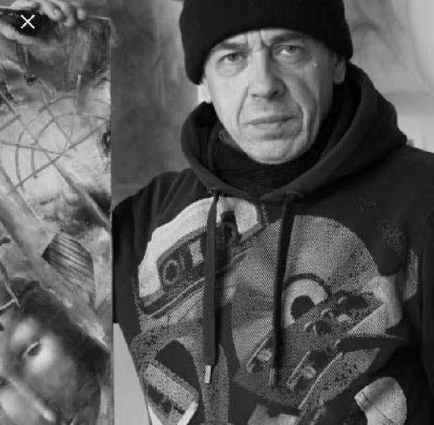 Black hoodie with a detailed graphic print featuring abstract mechanical and circular designs.