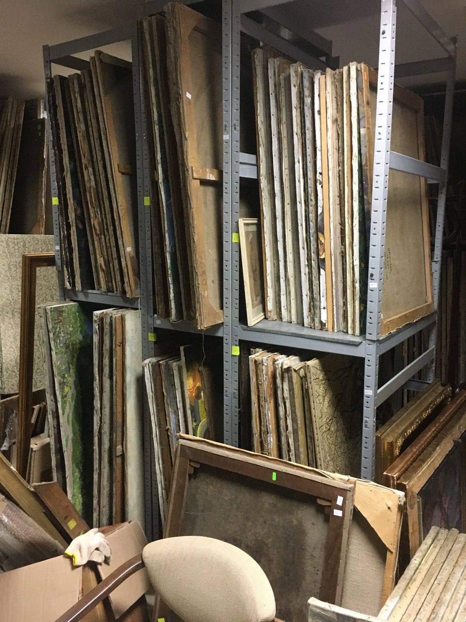 Aged weathered canvas paintings on metal shelves for wholesale