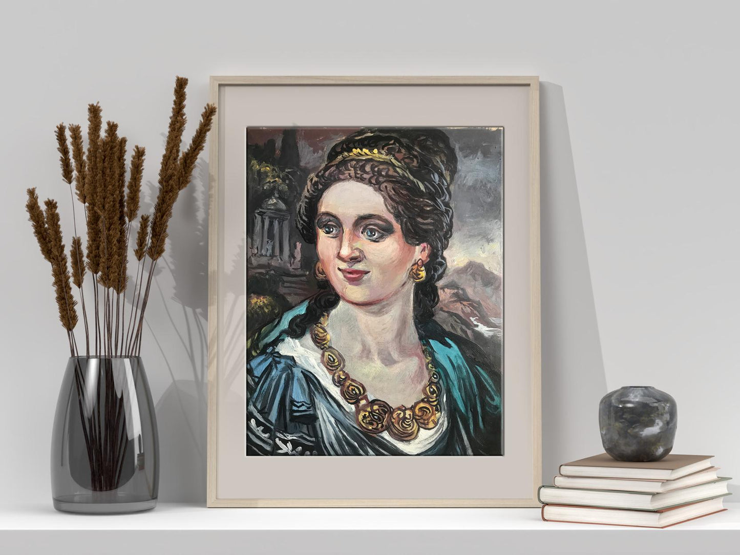 Framed portrait of a woman in an ornate blue gown with gold jewelry and braided hair, displayed within a light-colored frame.