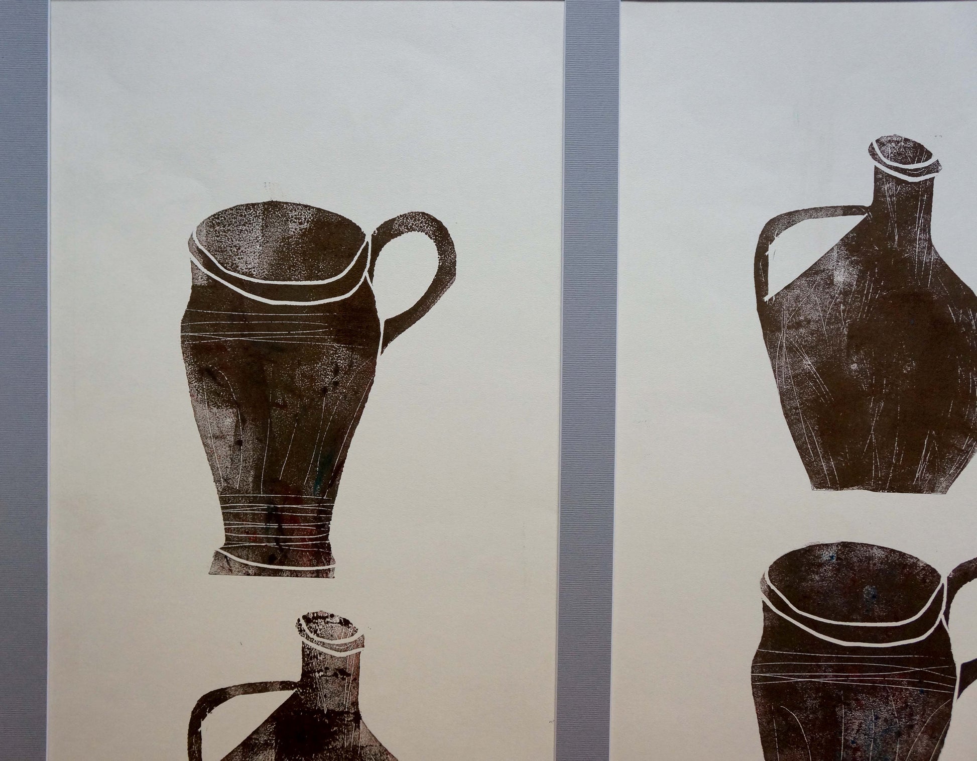 Black inked ceramic jug prints by Albina Yaloz on off-white paper