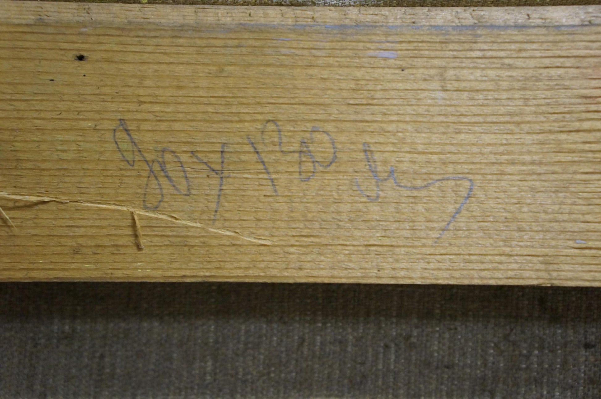 Handwritten purple ink signature on back of coastal oil painting