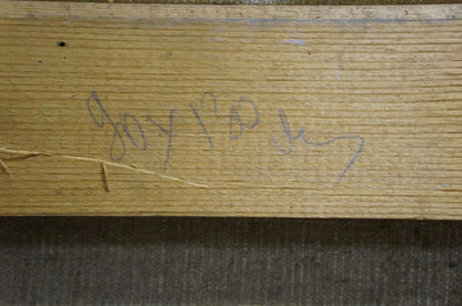 Handwritten purple ink signature on back of coastal oil painting
