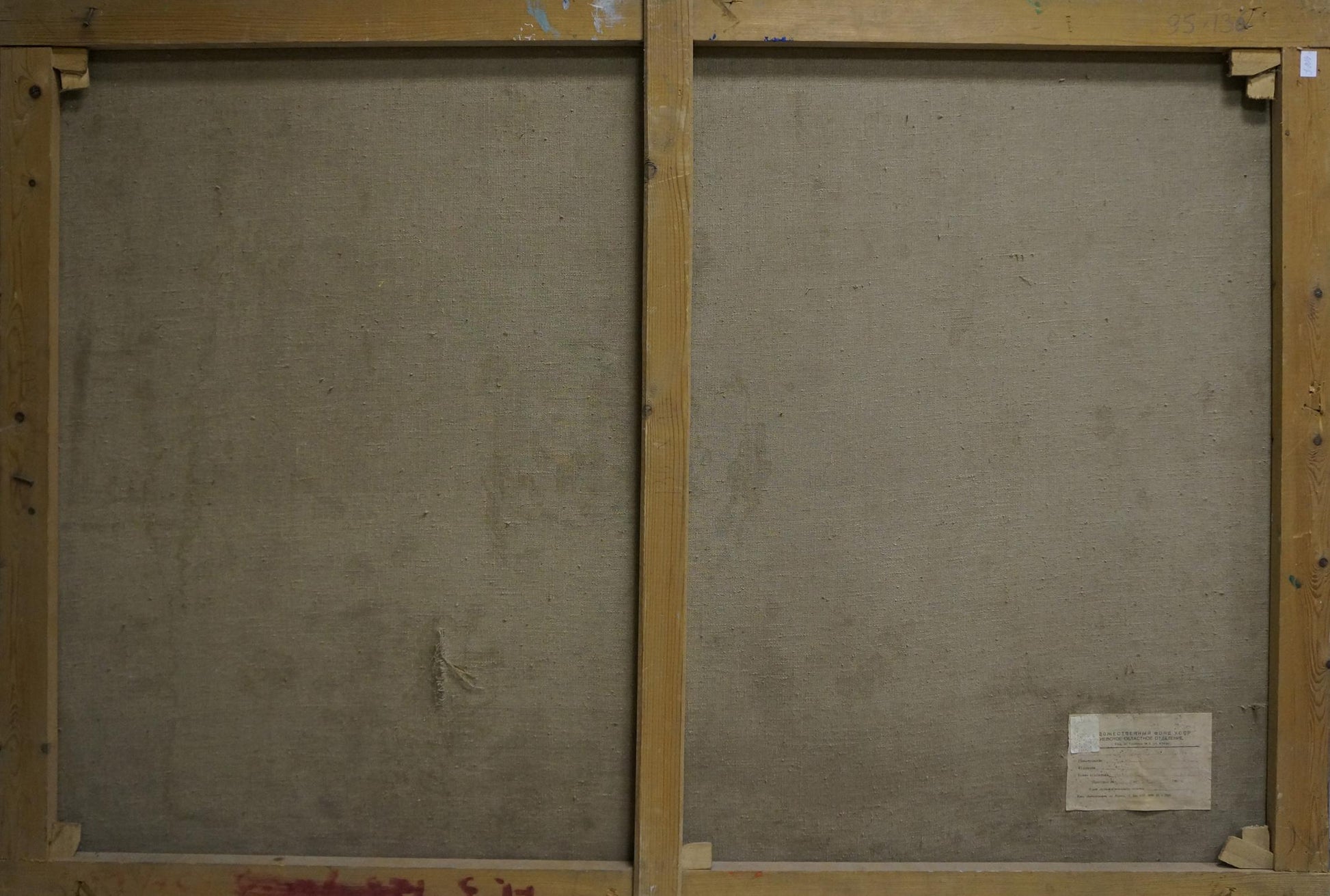 Back of sunny forest oil painting on two beige canvas panels with light wood frames