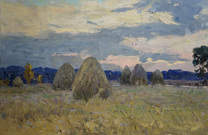 Oil painting by Tyukha Ivan Andreevich: golden hay bales under dramatic cloudy sky