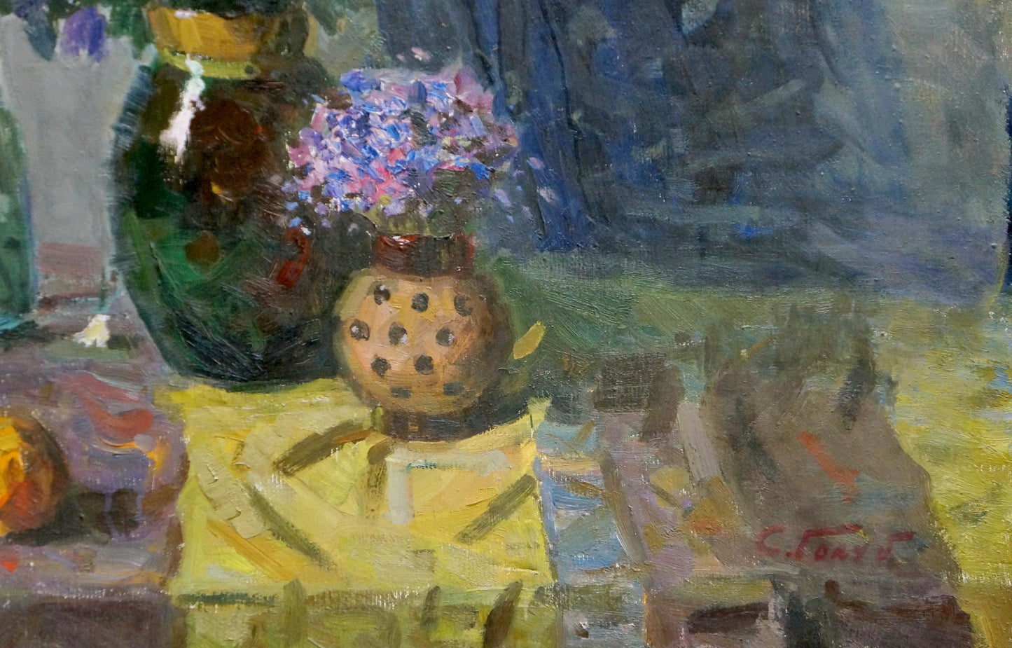 Oil painting of table with flowers in polka dot vase by Stepan Golub