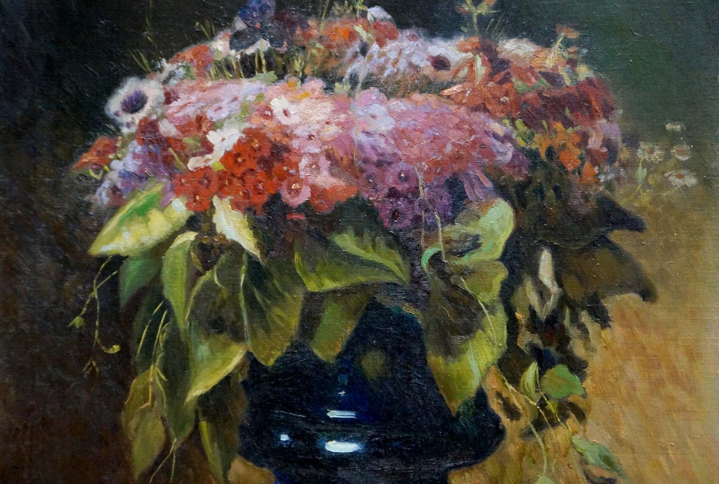Oil painting of lush bouquet of flowers Komyakhov in glossy dark blue vase