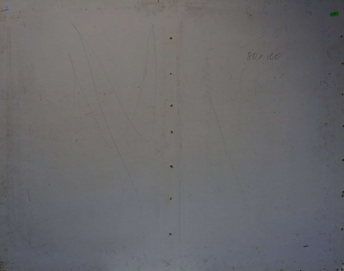 Back of oil painting by Konovalov Yuri Alexandrovich with plain off-white wall and faint smudges